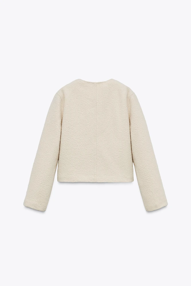 VESTE BOUCLÉ À BOUTONS