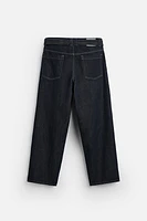 BELTED PLEATED JEANS