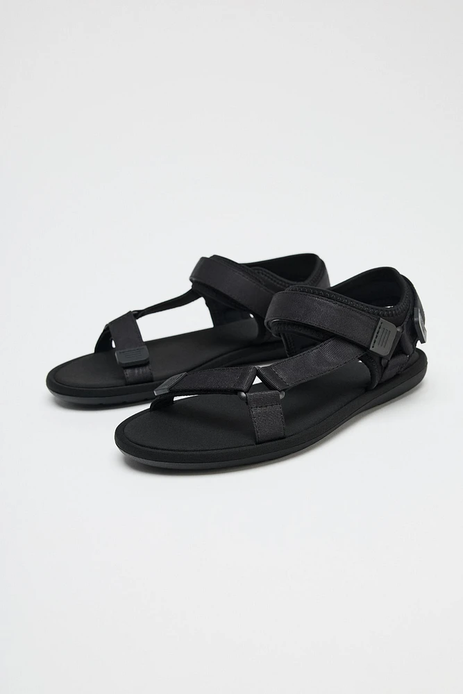 SANDALS WITH ADHESIVE STRAPS