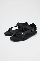 SANDALS WITH ADHESIVE STRAPS