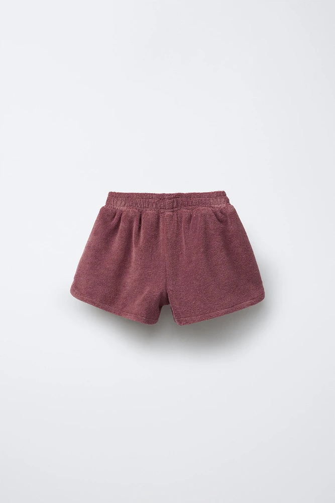 BERMUDA EN TISSU ÉPONGE AVEC BANDE LATÉRALE