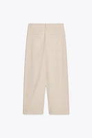 PLEATED CHINO PANTS