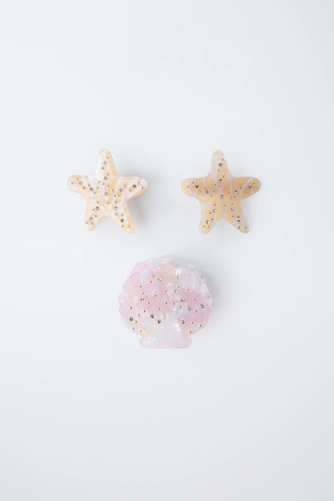 LOT DE TROIS PINCES COQUILLAGE ET ÉTOILES