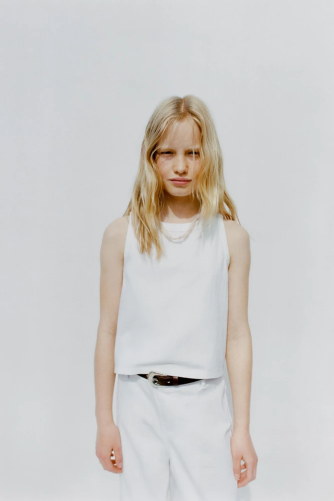 TOP SANS MANCHES ZIP