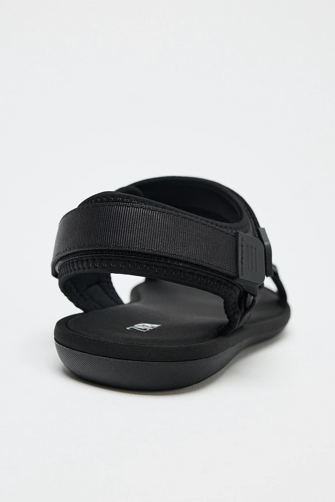 SANDALS WITH ADHESIVE STRAPS