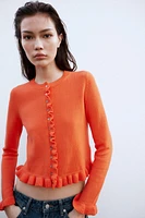 GILET EN MAILLE À VOLANTS