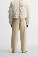 LIMITED EDITION RELAXED FIT PLEATED PANTS