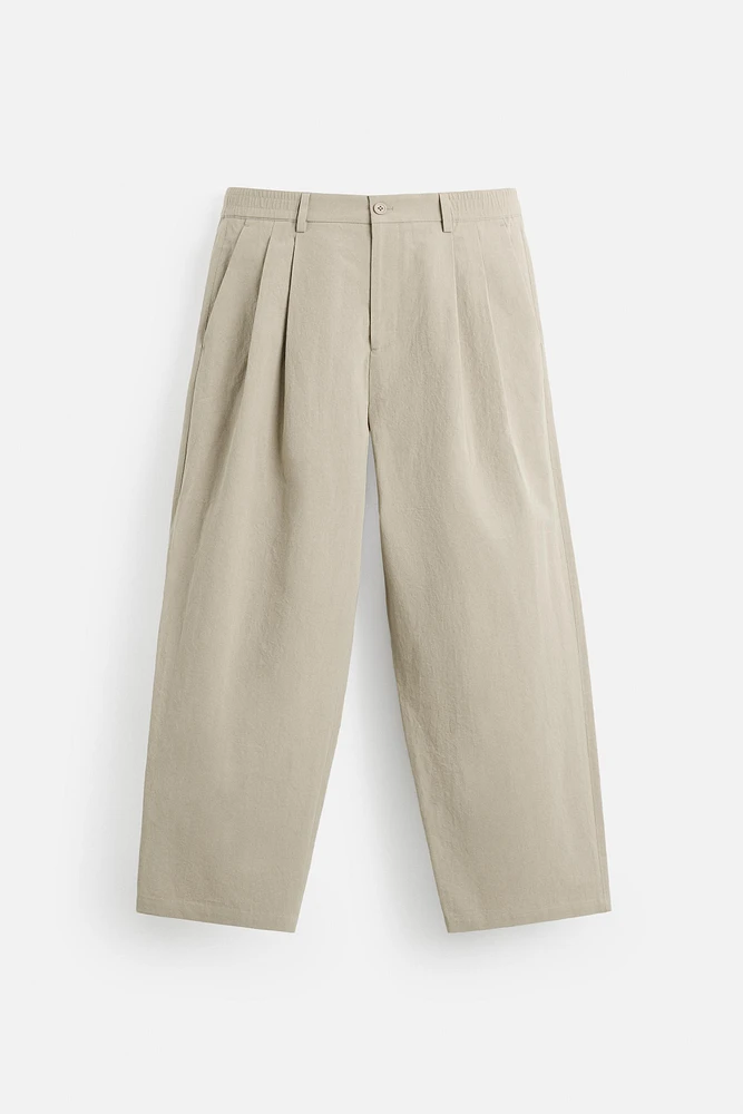 PLEATED CHINO PANTS