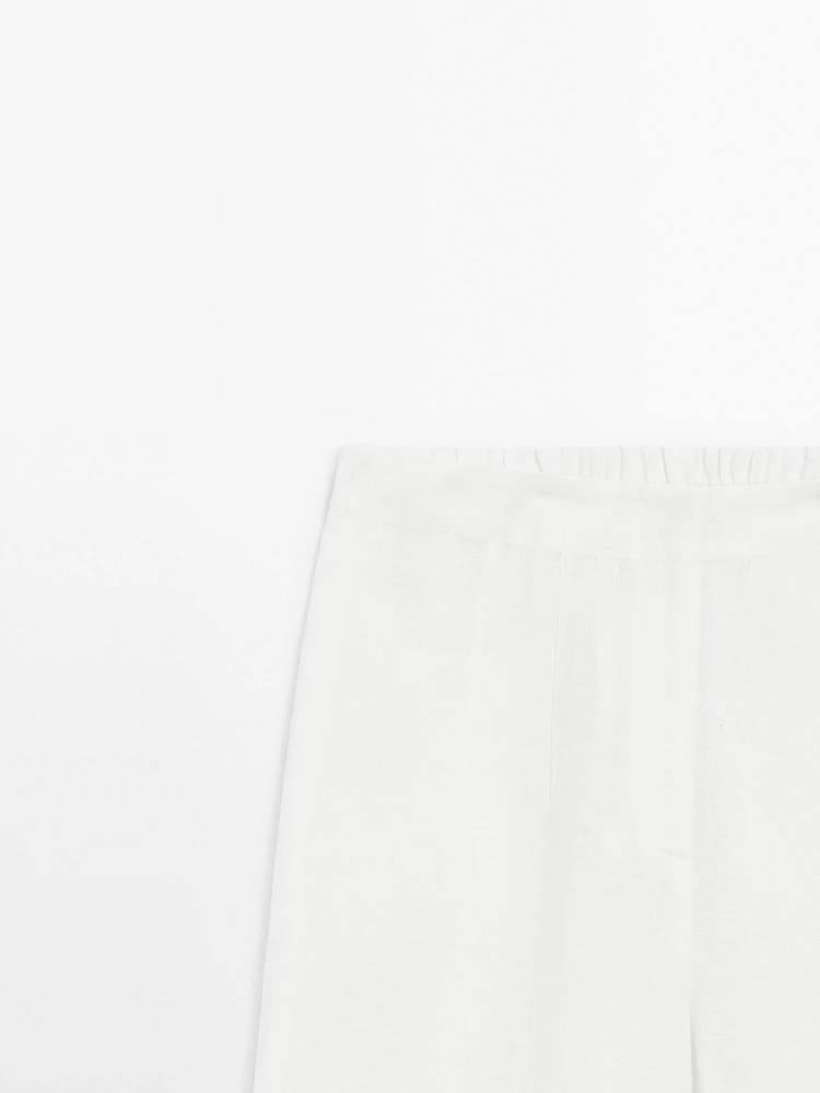 Wide-leg trousers with frayed detailing