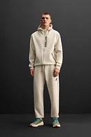 TECHNICAL ZIPPER JOGGER PANTS