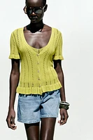 GILET EN MAILLE POINTELLE À VOLANTS