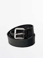 Leather belt with metallic buckle