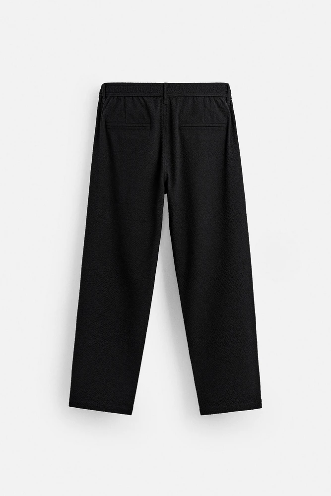 TEXTURED PLEATED PANTS