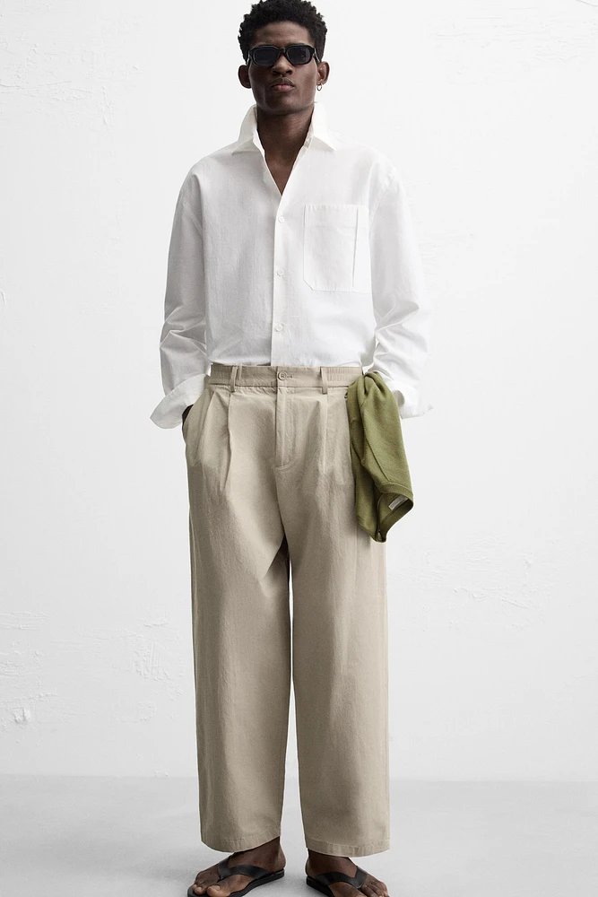 PLEATED CHINO PANTS