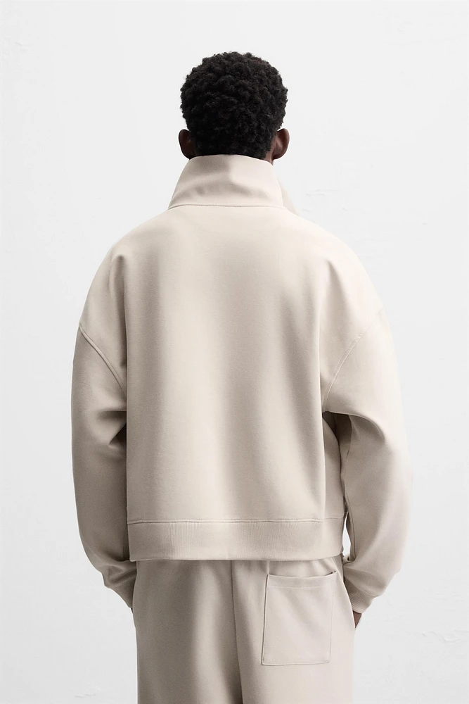 QUARTER ZIP TECHNICAL SWEATSHIRT