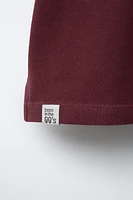 POLO BOXY FIT ÉTIQUETTE