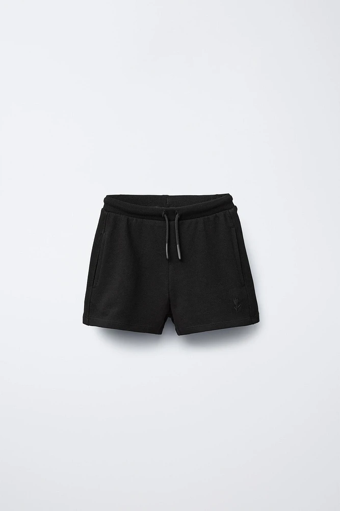 EMBROIDERED PLUSH SHORTS