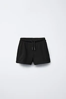 EMBROIDERED PLUSH SHORTS