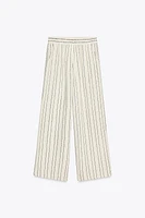 PANTALON RAYÉ À SEQUINS