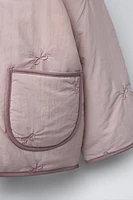 WATER REPELLENT PADDED JACKET WITH EMBROIDERED BOWS