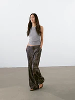 Distressed-effect flared trousers