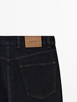 Tapered-fit denim trousers