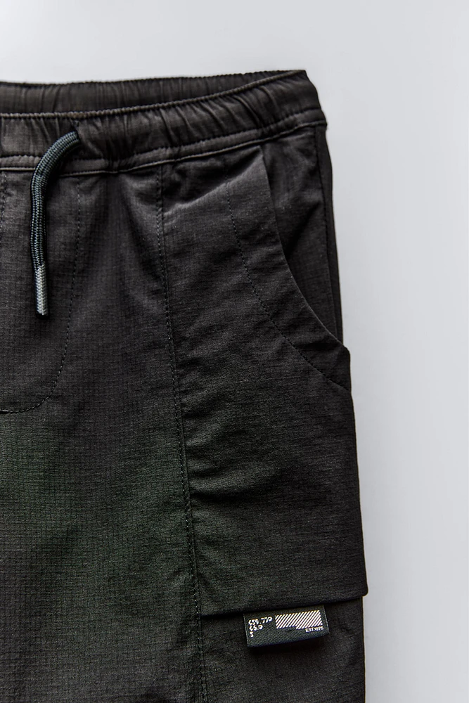 TECHNICAL FABRIC LINED PANTS WITH LABEL