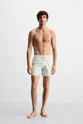 CONTRAST BANDS MID-LENGTH SWIMSUIT