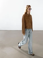 Blouson en cuir finition daim avec boutons doublés