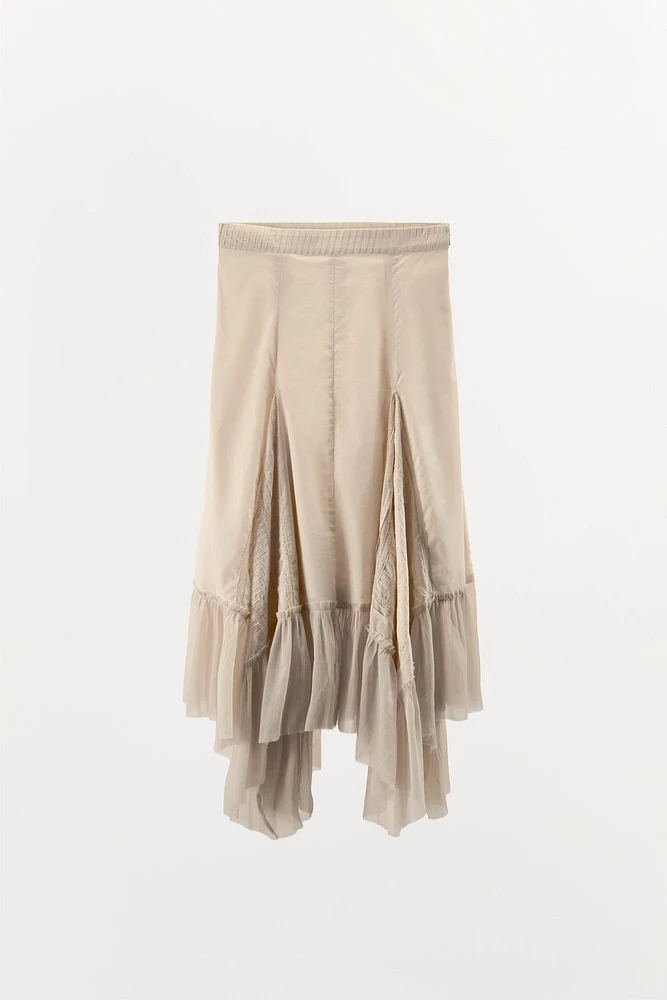 JUPE PLISSÉE ASYMÉTRIQUE