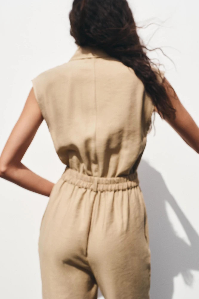 SLEEVELESS BELTED JUMPSUIT