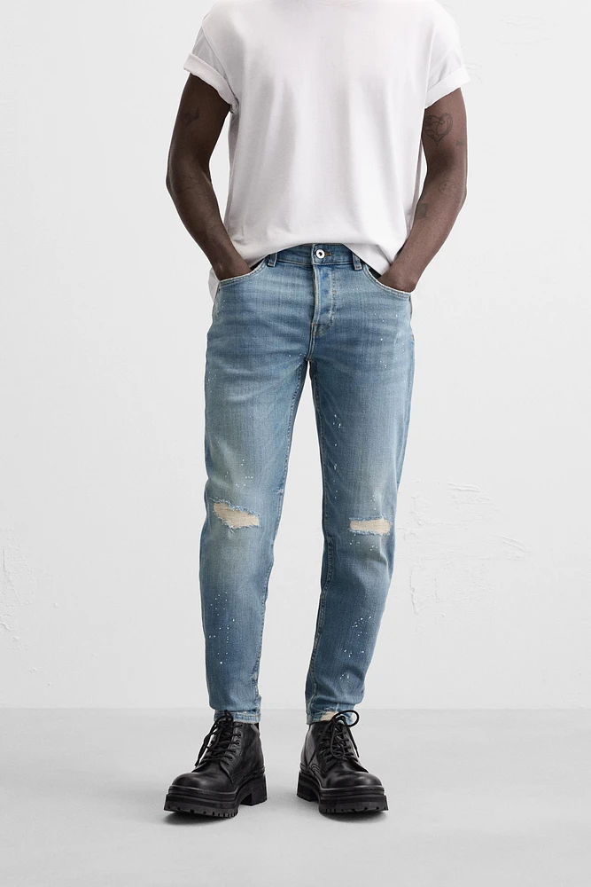 JEANS SKINNY AVEC DÉCHIRURES ET ÉCLABOUSSURES