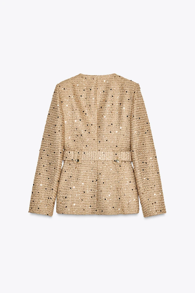 VESTE À SEQUINS ET CEINTURE