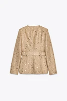 VESTE À SEQUINS ET CEINTURE