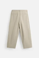 PLEATED CHINO PANTS