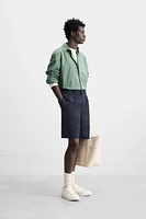 RELAXED FIT PLEATED SHORTS