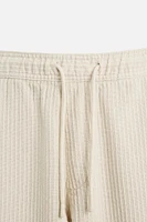 PANTALON EN JACQUARD À RAYURES