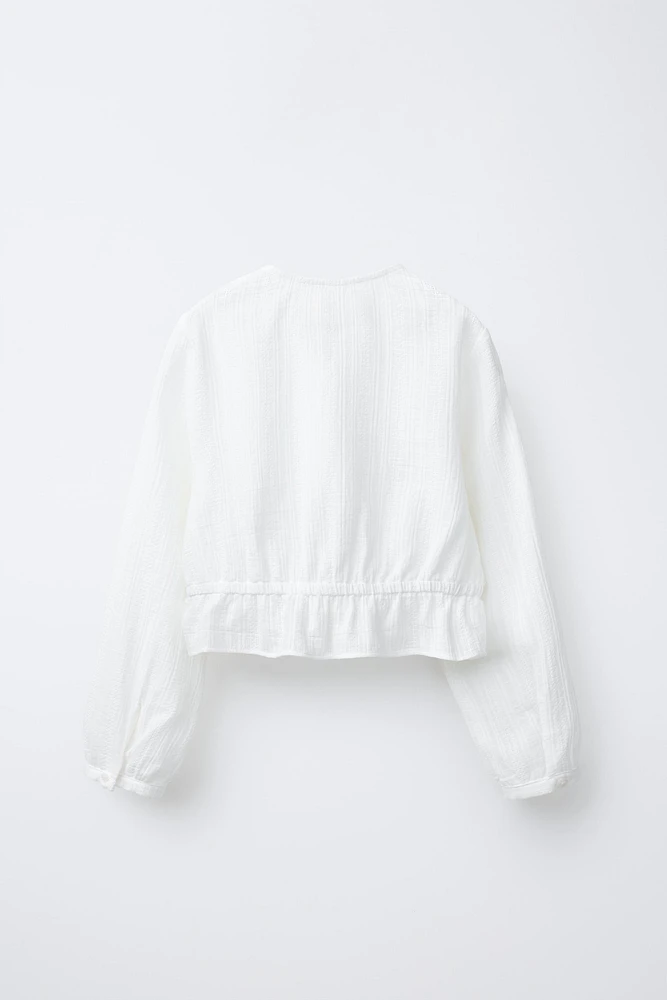 BLOUSE STRUCTURÉE AVEC LACET