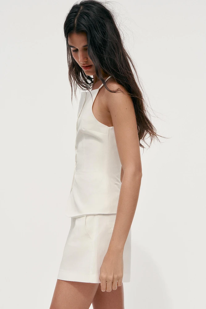 TOP GILET À BOUTONS