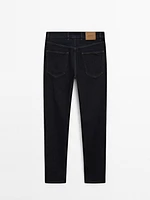 Tapered-fit denim trousers