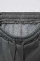 SEAMED PANTS WITH LABEL DETAIL