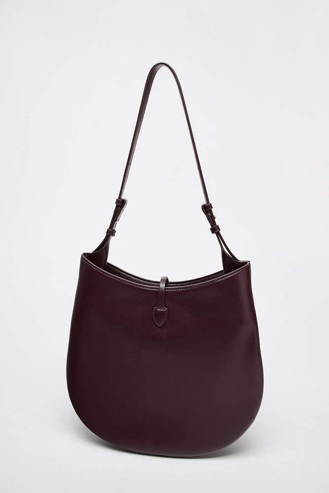 BUCKET BAG WITH PENDANT DETAIL