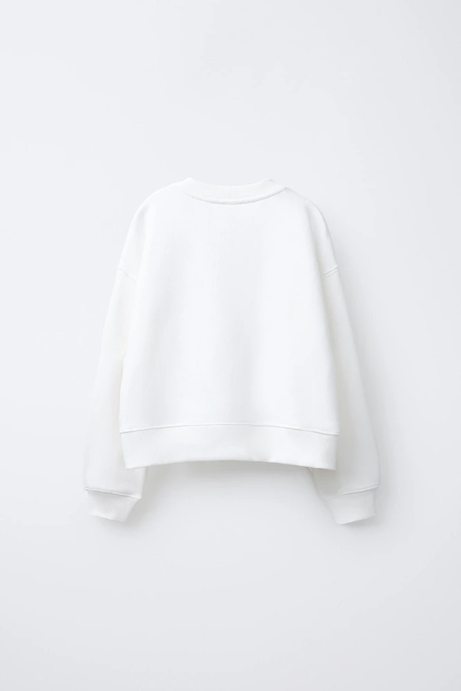 CINNAMOROLL © SANRIO RAISED GLITTER SWEATSHIRT