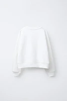 CINNAMOROLL © SANRIO RAISED GLITTER SWEATSHIRT