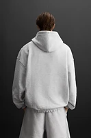 SWEAT À CAPUCHE ET ZIP