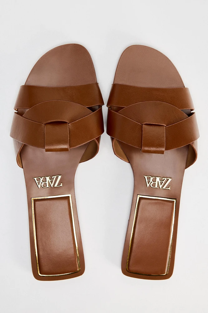 FLAT CROSSED LEATHER SANDALS