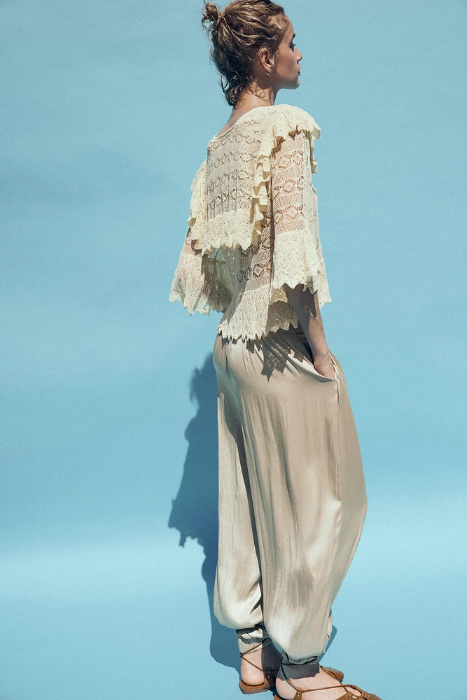 BLOUSE EN MAILLE POINTELLE À VOLANTS