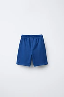 BERMUDA DE JOGGING ÉTIQUETTE