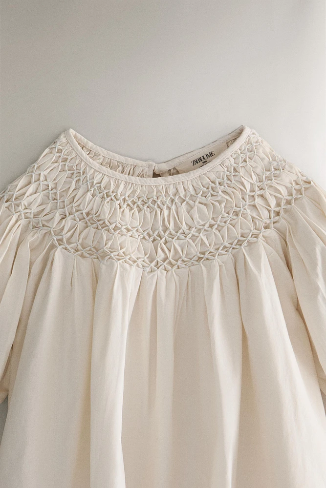 ROBE ENFANT NID D’ABEILLE