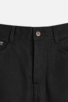 Slim fit jeans. Five pockets. Tonal topstitching. Front button closure.<br/><br/>Origins special collection.